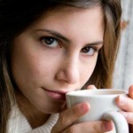 Woman Enjoying a Refreshing Cup of Dandelion Tea